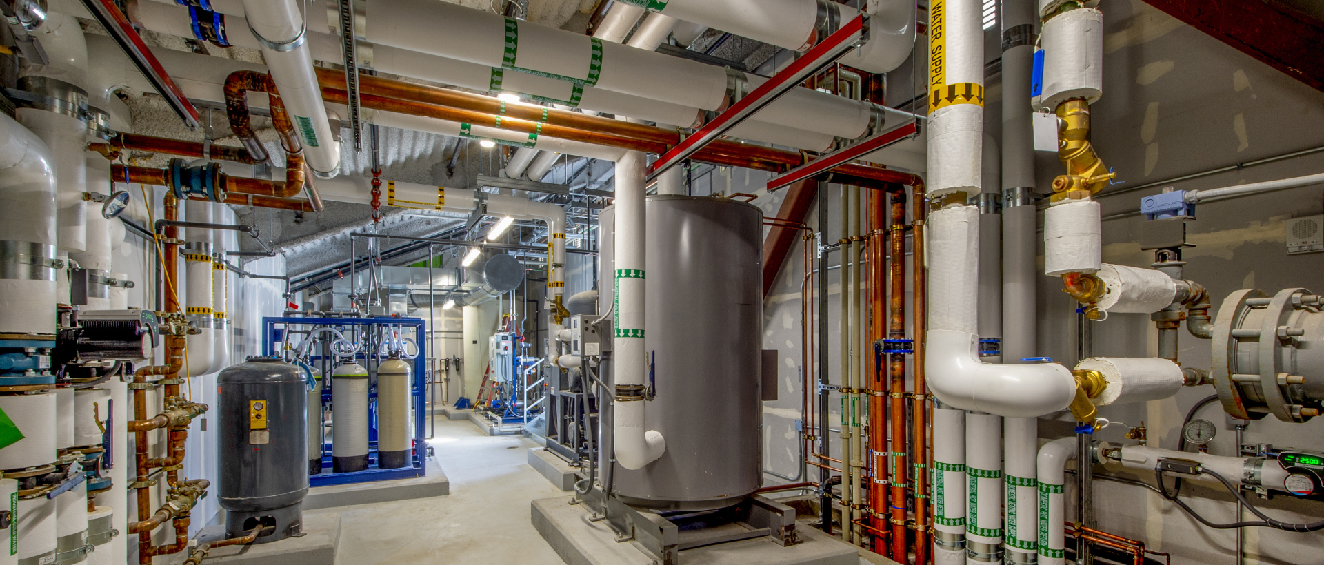 Pipes and water tanks in room
